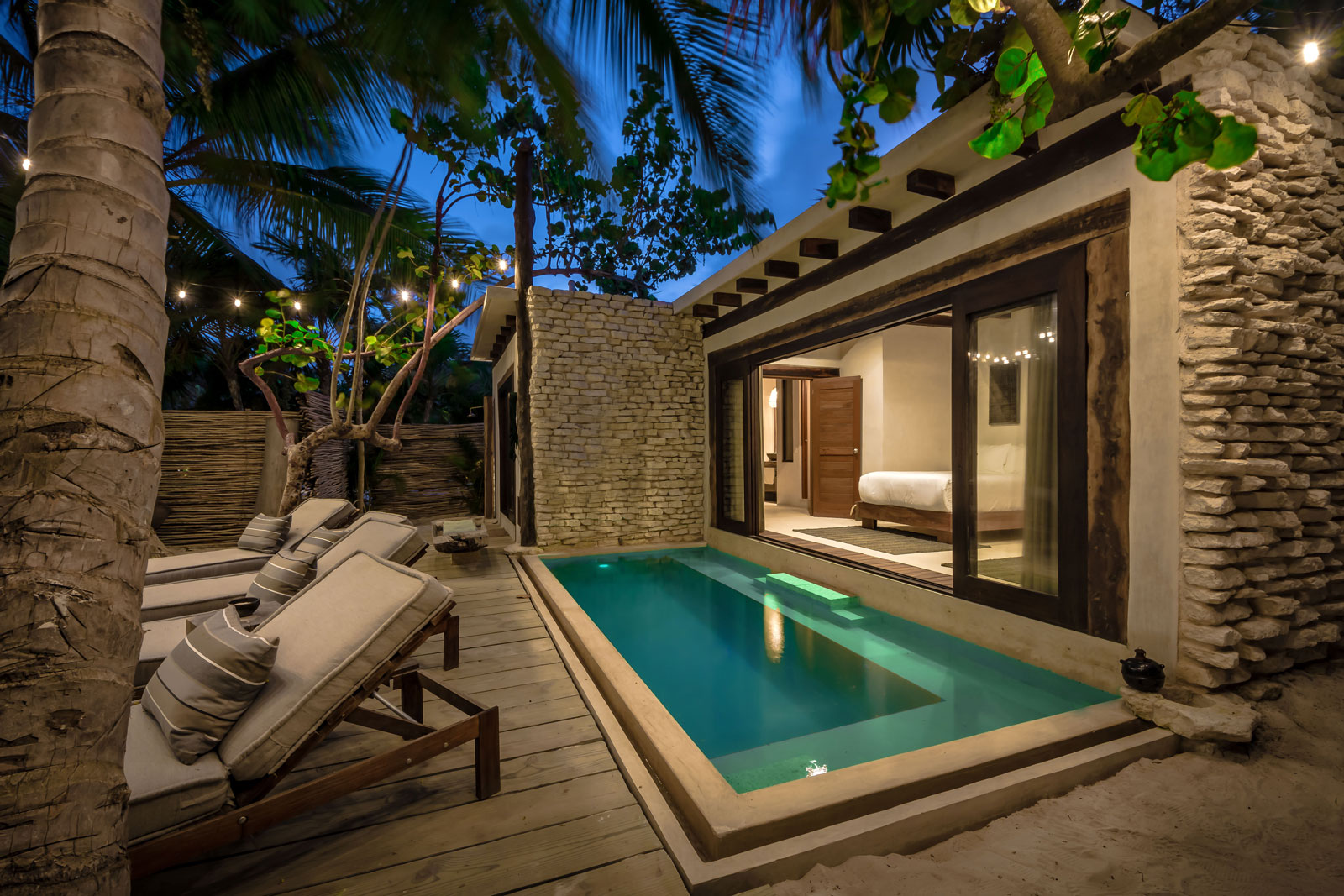 Casa Chukum in Tulum Villa, swimming pool and sun loungers at night