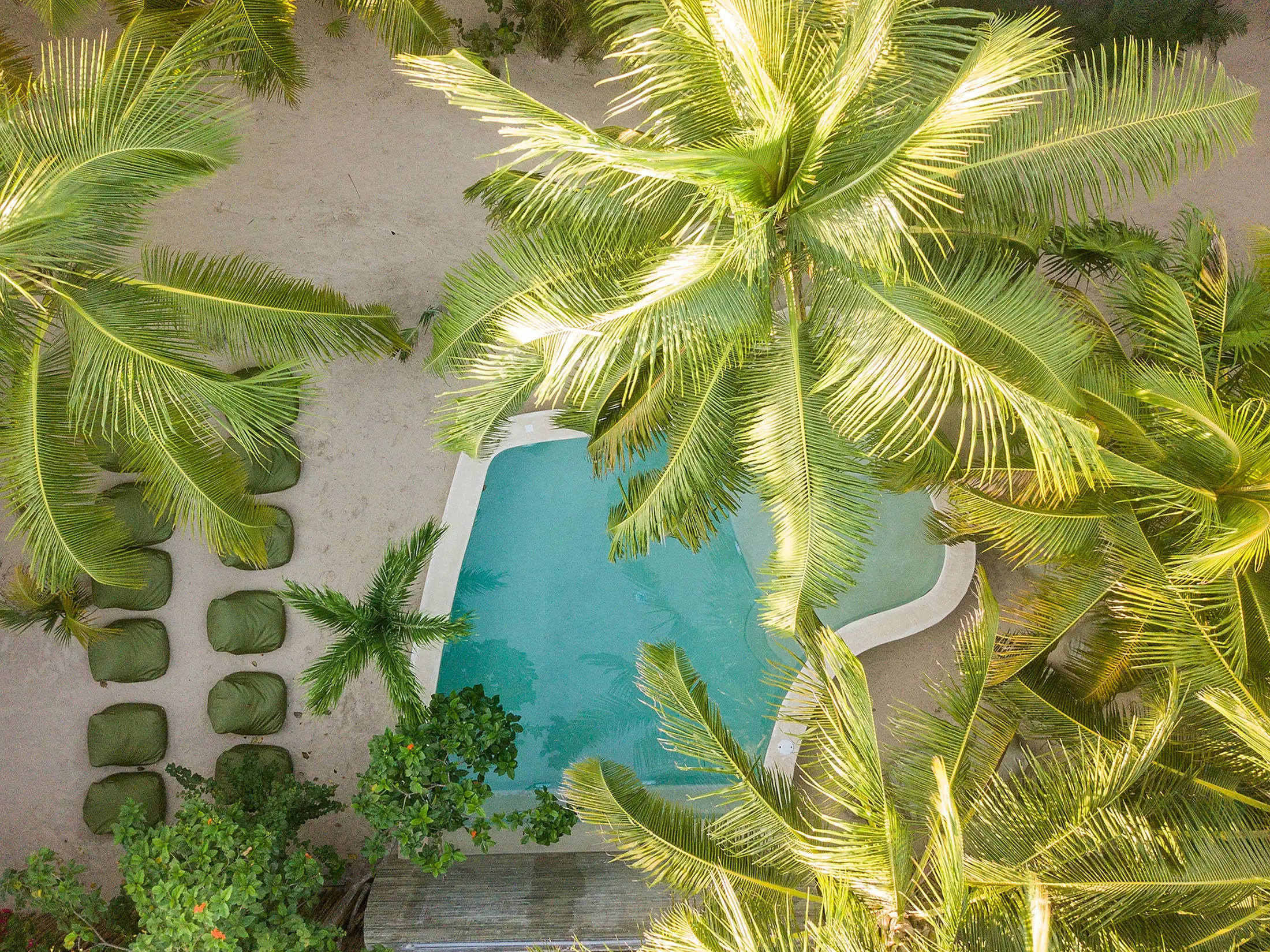 Zorba Cuatro in Tulum Aerial view of swimming pool and lounge chairs