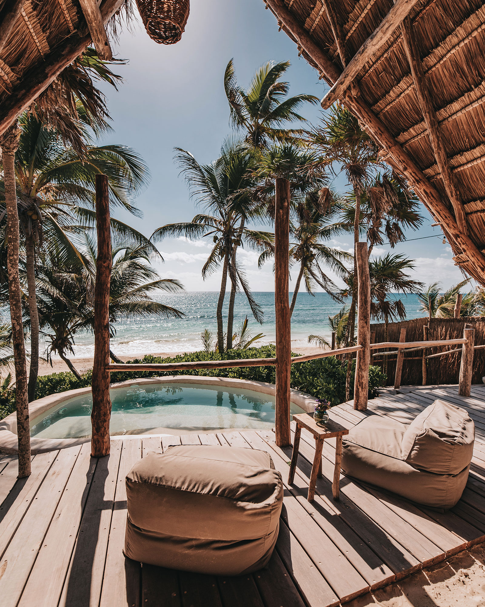 Beach cabana with lounge chairs with ocean view