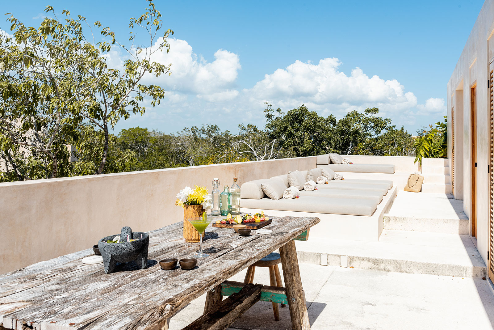 Candela Uno in Tulum Rooftop terrace with sun loungers and dining area