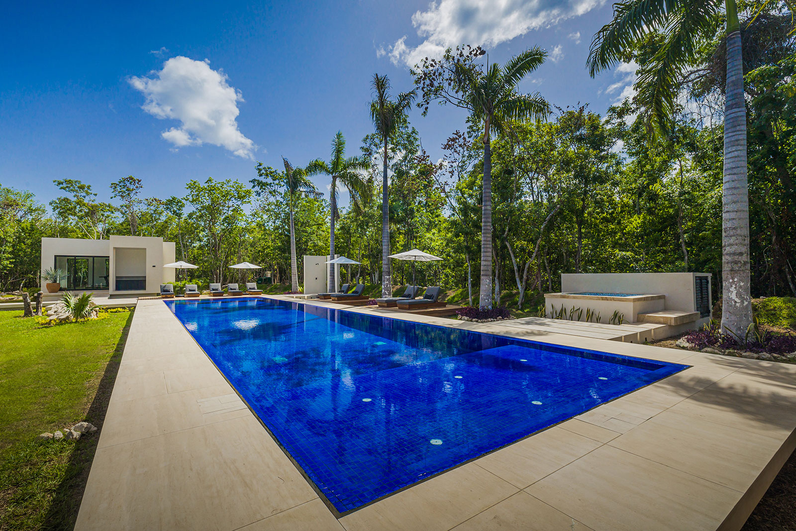 Villa L'and at Mariposa in Cozumel Swimming pool and lounge chairs with shade